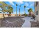 Landscaped backyard with gravel and a hot tub at 718 Glenwood Springs Ave, North Las Vegas, NV 89032