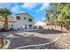 Large backyard with gravel landscaping and a patio at 718 Glenwood Springs Ave, North Las Vegas, NV 89032