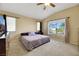 Spacious Primary bedroom with large bed, TV, and window views at 718 Glenwood Springs Ave, North Las Vegas, NV 89032