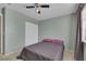 Serene bedroom with ceiling fan, window, and neutral color scheme at 718 Glenwood Springs Ave, North Las Vegas, NV 89032