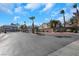 Gated community entrance with palm trees and ample parking at 718 Glenwood Springs Ave, North Las Vegas, NV 89032