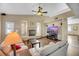 Living room with a fireplace, hardwood floors, and comfortable sofas at 718 Glenwood Springs Ave, North Las Vegas, NV 89032