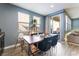 Dining area with table and chairs, adjacent to the kitchen and backyard access at 7563 Chimney Point Ct, Las Vegas, NV 89166