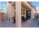 Relaxing covered patio with seating area and grill at 7563 Chimney Point Ct, Las Vegas, NV 89166