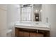 Clean bathroom with a single sink and wood cabinets at 796 Tam O Shanter, Las Vegas, NV 89109