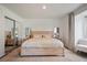 Main bedroom with light wood platform bed and sliding mirrored closet doors at 796 Tam O Shanter, Las Vegas, NV 89109