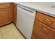 Modern kitchen with wood cabinets and GE dishwasher at 796 Tam O Shanter, Las Vegas, NV 89109