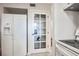 White kitchen appliances and pantry with glass door at 796 Tam O Shanter, Las Vegas, NV 89109