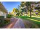 Brick pathway leading to green grass and trees at 796 Tam O Shanter, Las Vegas, NV 89109