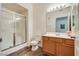 Bathroom with wood vanity, toilet, and shower stall at 833 Aspen Peak Loop # 2524, Henderson, NV 89011