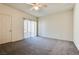 Spacious bedroom with ceiling fan and sliding glass door at 833 Aspen Peak Loop # 2524, Henderson, NV 89011