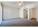 Large bedroom with ceiling fan and access to bathroom at 833 Aspen Peak Loop # 2524, Henderson, NV 89011