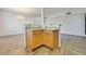 Kitchen island with granite countertop and wood cabinets at 833 Aspen Peak Loop # 2524, Henderson, NV 89011