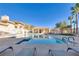 Community pool with lounge chairs and covered patio at 833 Aspen Peak Loop # 2524, Henderson, NV 89011