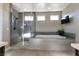 Elegant bathroom with soaking tub, walk-in shower, and modern fixtures at 8435 Great Outdoors St, Las Vegas, NV 89166