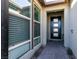 Front entry with black modern door, sidelights, and brick walkway at 8435 Great Outdoors St, Las Vegas, NV 89166