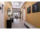 Open entryway with wood slat accent wall, offering a view into the living room at 8435 Great Outdoors St, Las Vegas, NV 89166