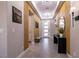 Bright entryway with wood slat wall, bench, and modern decor at 8435 Great Outdoors St, Las Vegas, NV 89166