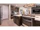 Island kitchen with stainless steel appliances and modern cabinets at 8435 Great Outdoors St, Las Vegas, NV 89166