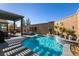 Inviting pool and spa with pergola and landscaping at 8435 Great Outdoors St, Las Vegas, NV 89166