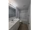 Updated bathroom with white vanity and bathtub at 8600 W Charleston Blvd # 1129, Las Vegas, NV 89117