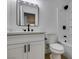 Updated bathroom with white vanity, quartz countertop, and modern fixtures at 8712 Majestic Pine Ave, Las Vegas, NV 89143