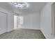 Spacious bedroom featuring a ceiling light and door to hallway at 8712 Majestic Pine Ave, Las Vegas, NV 89143