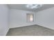 Well-lit bedroom with window and neutral colored carpet at 8712 Majestic Pine Ave, Las Vegas, NV 89143