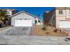 Single-story house with attached garage and small front yard at 8712 Majestic Pine Ave, Las Vegas, NV 89143