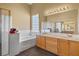 Main bathroom with a bathtub and shower at 8728 Burning Hide Ave, Las Vegas, NV 89143