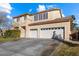 Two-story house with a three-car garage and landscaped front yard at 8728 Burning Hide Ave, Las Vegas, NV 89143