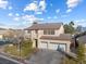 Two-story house with three-car garage and landscaped yard at 8728 Burning Hide Ave, Las Vegas, NV 89143