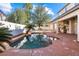 Relaxing pool area with a kidney-shaped pool and spacious patio at 8728 Burning Hide Ave, Las Vegas, NV 89143