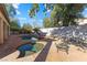 Relaxing backyard oasis featuring a sparkling pool, spa, and fire pit at 8728 Burning Hide Ave, Las Vegas, NV 89143