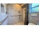 Accessible bathroom with walk-in shower and safety bars at 8821 Sandspring Dr, Las Vegas, NV 89134