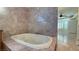 Primary bathroom with a luxurious jetted tub at 8821 Sandspring Dr, Las Vegas, NV 89134