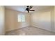 Well-lit bedroom with ceiling fan and marble tile floors at 8821 Sandspring Dr, Las Vegas, NV 89134