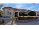 One-story house with stone and tile; landscaped front yard at 8821 Sandspring Dr, Las Vegas, NV 89134