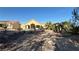 Tan house with red tile roof and desert landscaping at 8821 Sandspring Dr, Las Vegas, NV 89134