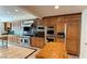 Large kitchen with stainless steel appliances and wood cabinetry at 8821 Sandspring Dr, Las Vegas, NV 89134