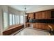 Breakfast nook with built-in seating and wood cabinets at 8821 Sandspring Dr, Las Vegas, NV 89134