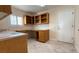 Laundry room with built-in cabinets and workspace at 8821 Sandspring Dr, Las Vegas, NV 89134