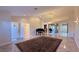 Bright living room with a piano, high ceilings, and tile floors at 8821 Sandspring Dr, Las Vegas, NV 89134