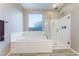 Bathroom with soaking tub and walk-in shower at 8853 Sherborne Gate Ave, Las Vegas, NV 89148