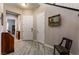 Bright entryway with tile flooring, coat closet and a view into the living room at 8853 Sherborne Gate Ave, Las Vegas, NV 89148