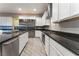 Modern kitchen with stainless steel appliances and granite countertops at 8853 Sherborne Gate Ave, Las Vegas, NV 89148