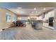 Modern kitchen with white cabinets, stainless steel appliances, and a large island at 8853 Sherborne Gate Ave, Las Vegas, NV 89148