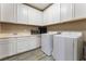 Laundry room with washer, dryer, and ample storage at 8853 Sherborne Gate Ave, Las Vegas, NV 89148