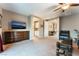 Main bedroom with large TV, dresser, and sitting area at 8853 Sherborne Gate Ave, Las Vegas, NV 89148