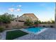 Spacious backyard with a refreshing pool and grassy area at 8853 Sherborne Gate Ave, Las Vegas, NV 89148